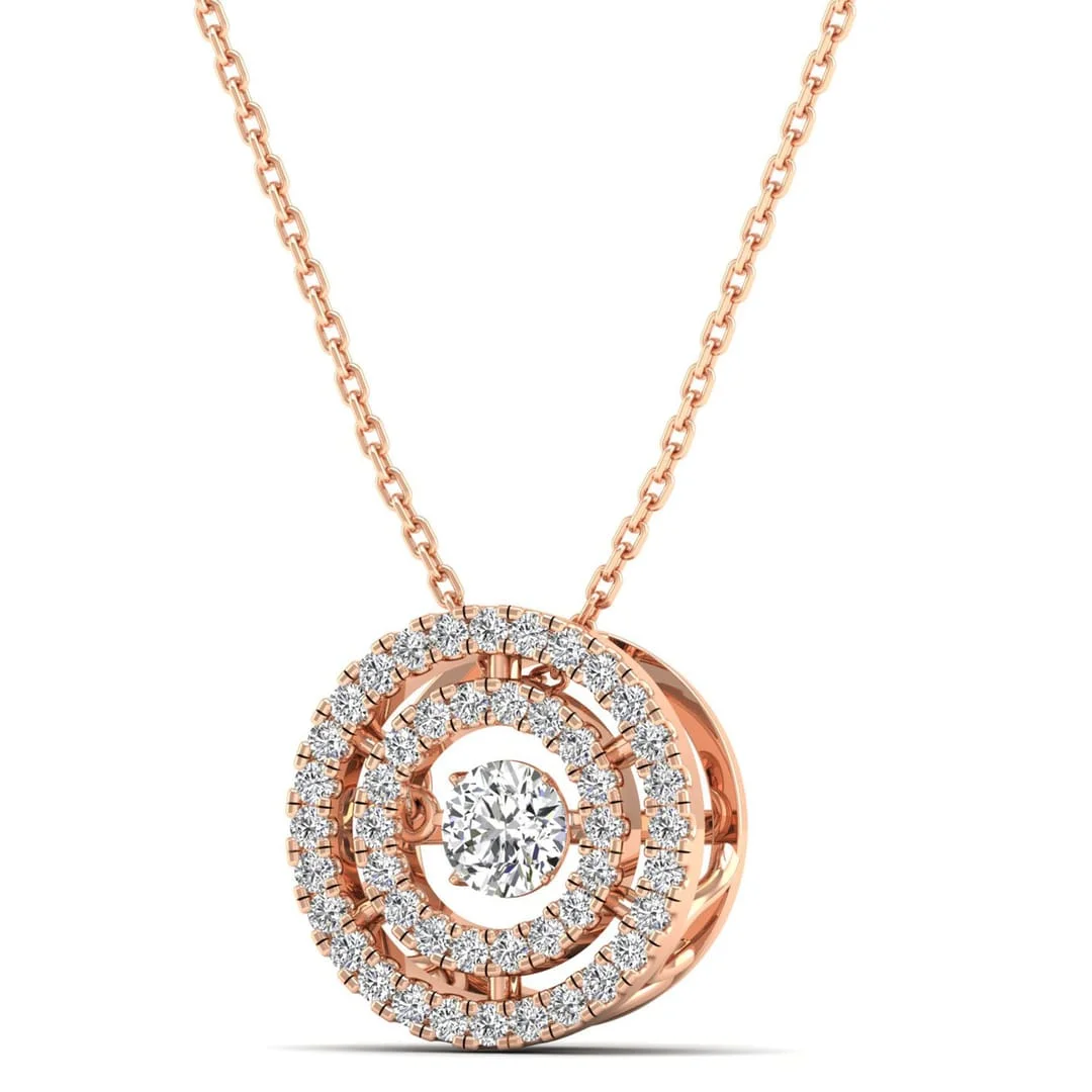 UGC photo of a jewelry designer sketchpad with gold rings next to a laptop displaying final images