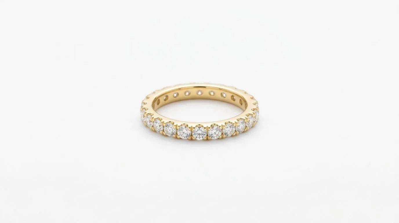 Gold diamond band ring on a pure white background conforming to e-commerce compliance rules